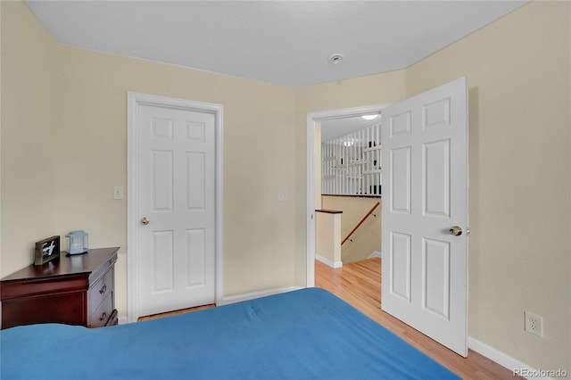 bedroom with wood-type flooring