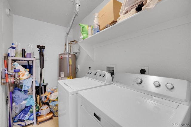 laundry room featuring gas water heater and washing machine and dryer