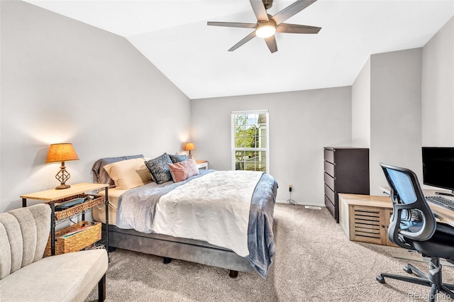 carpeted bedroom with baseboards, ceiling fan, and vaulted ceiling