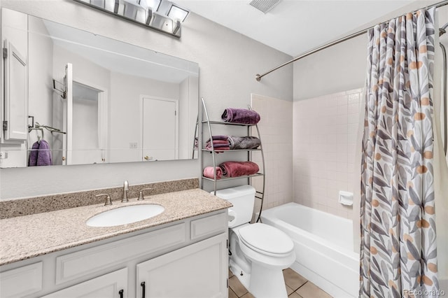 full bath featuring visible vents, vanity, shower / bath combo with shower curtain, toilet, and tile patterned floors