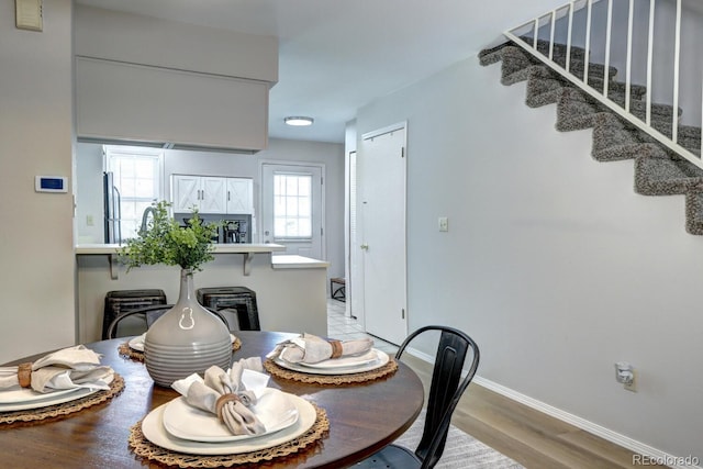 19804 Summerset Ln, Parker, CO 80138 - dining room featuring light wood-style floors and stairs