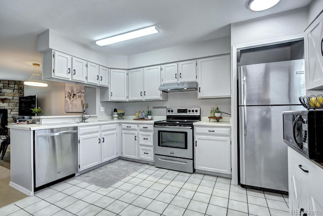 19804 Summerset Ln, Parker, CO 80138 - kitchen with appliances with stainless steel finishes, under cabinet range hood, light countertops, white cabinetry, and a peninsula