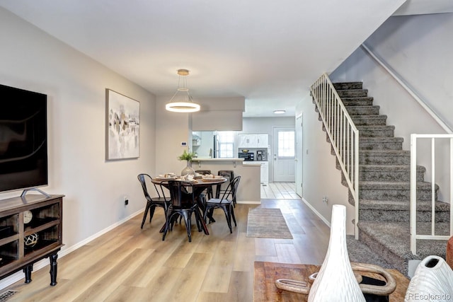 19804 Summerset Ln, Parker, CO 80138 - dining space with stairs and light wood-style flooring
