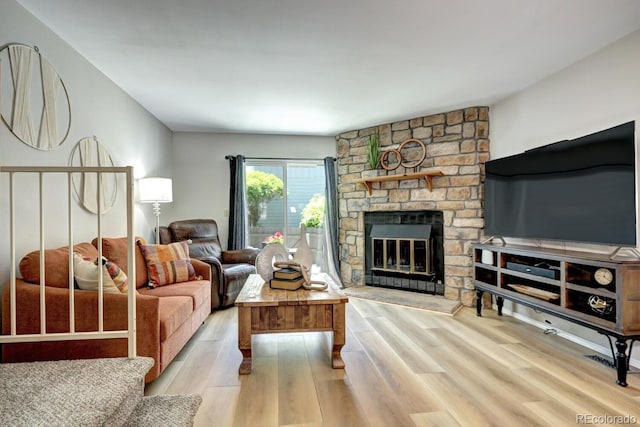 19804 Summerset Ln, Parker, CO 80138 - living room featuring a fireplace and wood finished floors