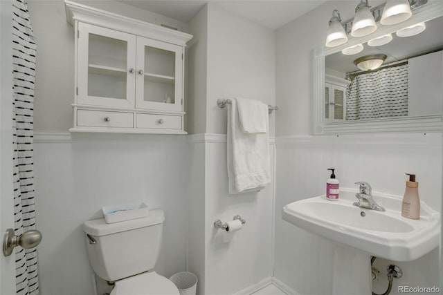 bathroom featuring sink and toilet