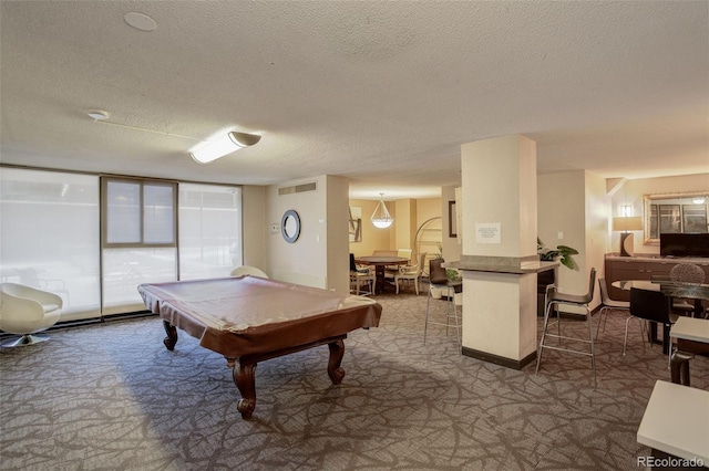 recreation room with pool table, carpet flooring, and a textured ceiling