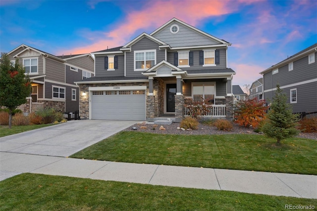 craftsman inspired home featuring a garage, covered porch, and a lawn