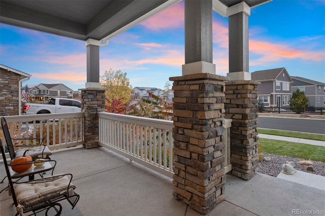 patio terrace at dusk with covered porch