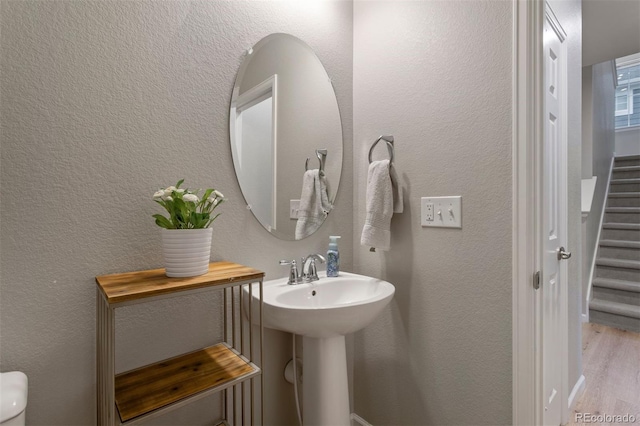 bathroom featuring sink and hardwood / wood-style floors