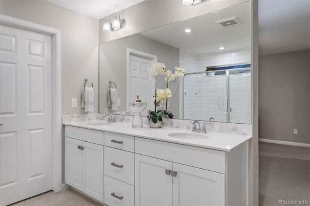 bathroom with vanity, walk in shower, and tile patterned floors