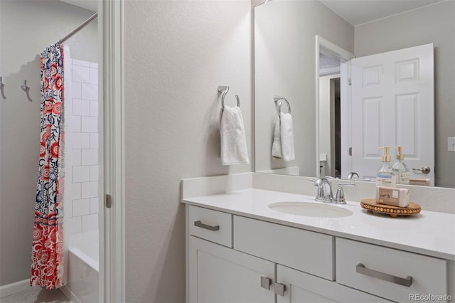 bathroom featuring shower / bathtub combination with curtain and vanity