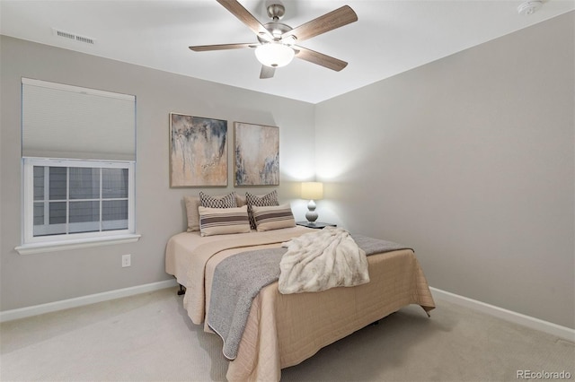 bedroom featuring ceiling fan and light colored carpet