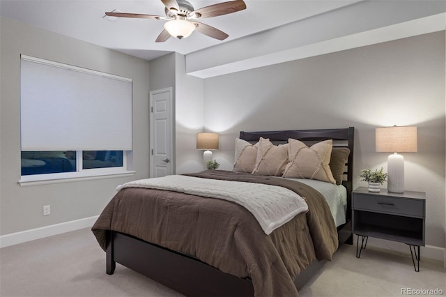 bedroom with light carpet and ceiling fan