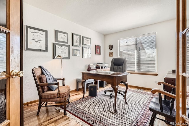office featuring light wood finished floors and baseboards