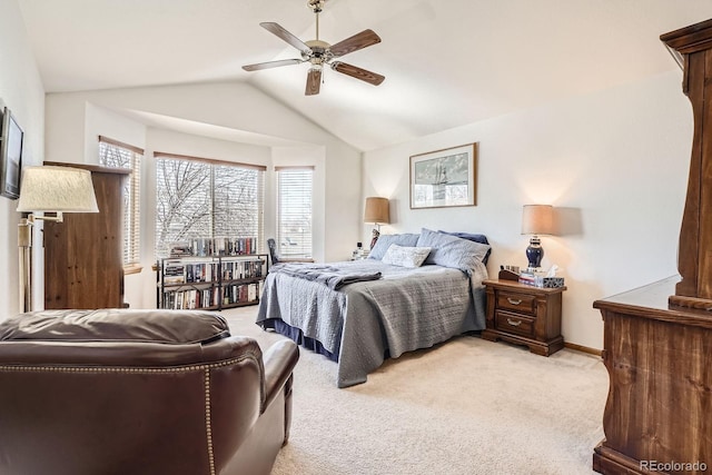 bedroom featuring light carpet, ceiling fan, baseboards, and lofted ceiling