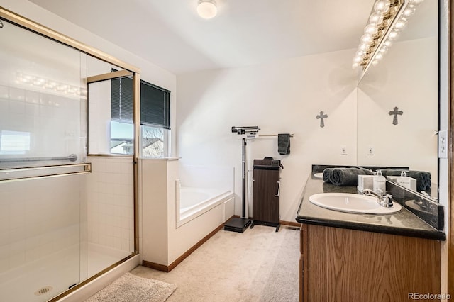 full bathroom featuring a shower stall, a bath, vanity, and baseboards