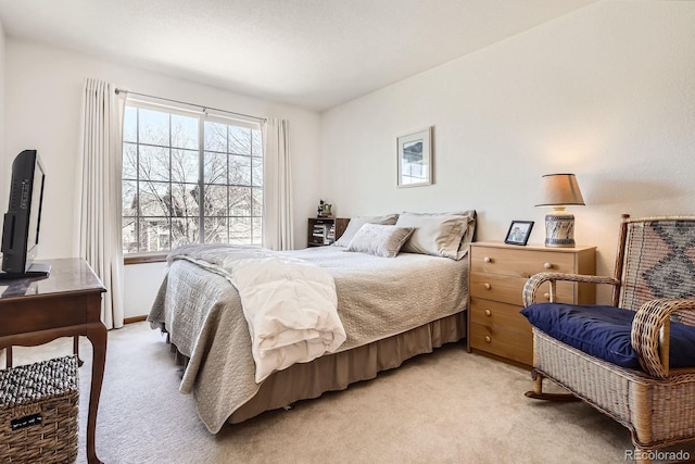 bedroom with light carpet