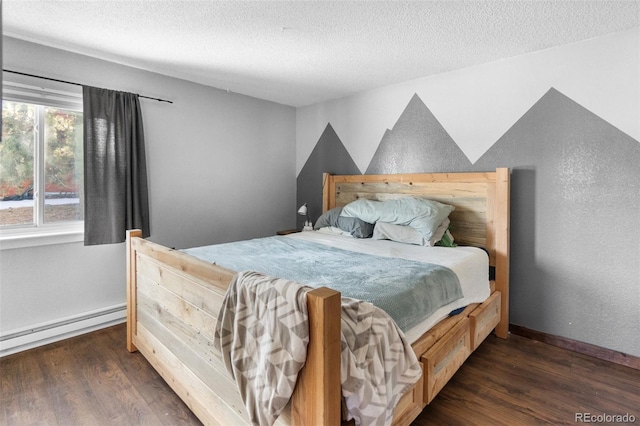 bedroom with a baseboard heating unit, a textured ceiling, and dark wood-type flooring