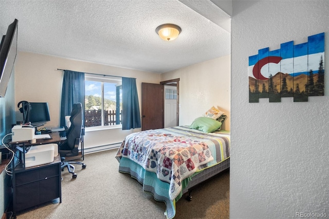 carpeted bedroom with a baseboard radiator and a textured ceiling