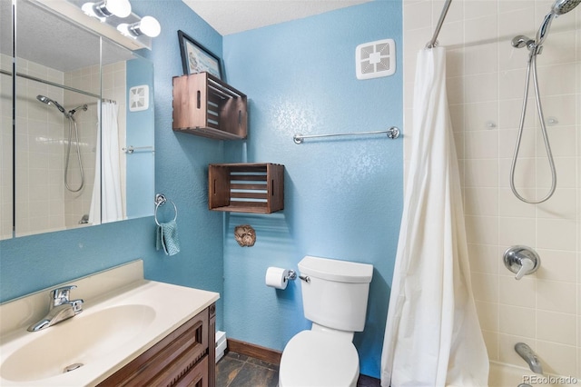 full bathroom featuring a textured ceiling, vanity, toilet, and shower / bath combo with shower curtain