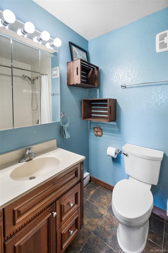 bathroom featuring a shower with curtain, vanity, and toilet