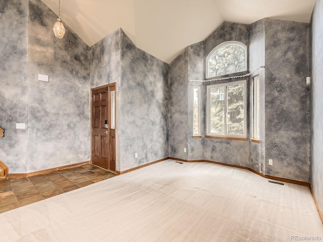 9412 La Quinta Way, Lone Tree, CO 80124 - empty room featuring baseboards and high vaulted ceiling