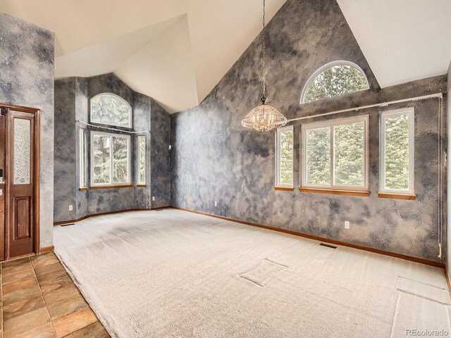 9412 La Quinta Way, Lone Tree, CO 80124 - foyer with lofted ceiling, a chandelier, and baseboards