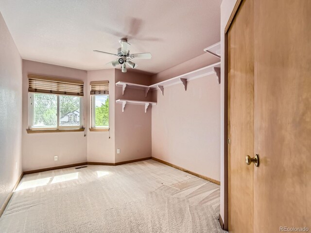 9412 La Quinta Way, Lone Tree, CO 80124 - spacious closet featuring a ceiling fan and light colored carpet