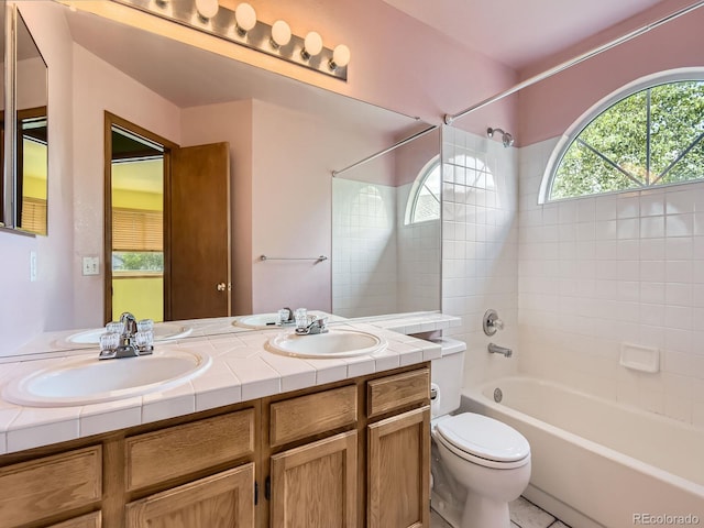 9412 La Quinta Way, Lone Tree, CO 80124 - bathroom featuring toilet,  shower combination, and double vanity