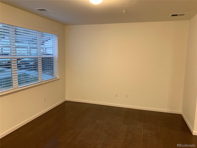 empty room with wood-type flooring