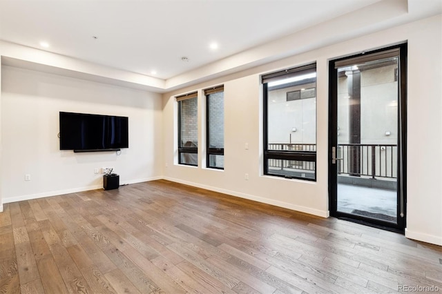 unfurnished living room featuring hardwood / wood-style floors