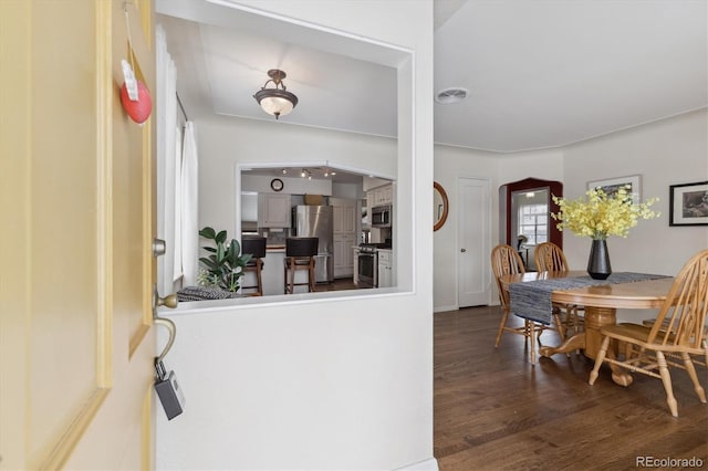 interior space with dark hardwood / wood-style flooring