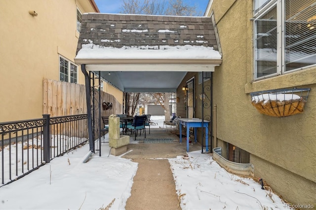 view of snow covered patio