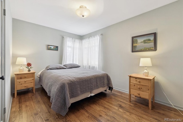 bedroom featuring dark hardwood / wood-style flooring