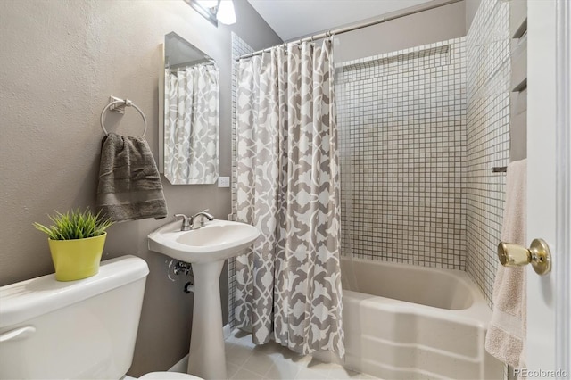 bathroom with toilet and shower / bath combo