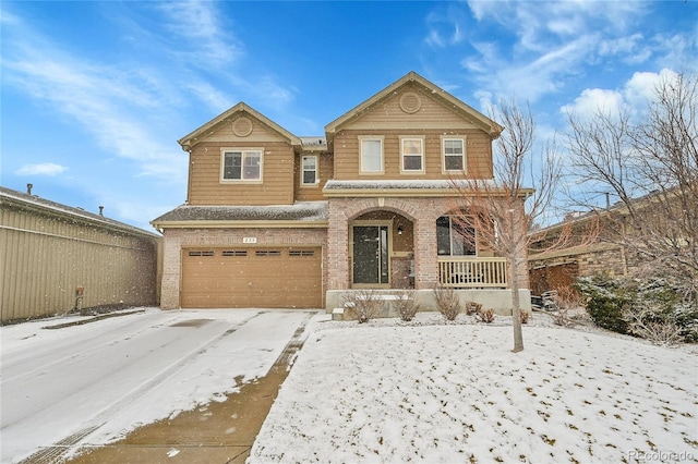 view of front of property with a garage and covered porch