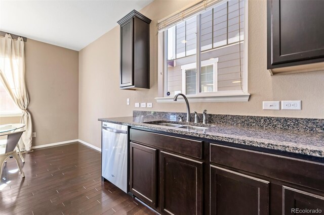 kitchen featuring dark hardwood / wood-style flooring, sink, a wealth of natural light, and dishwasher