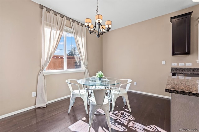 dining space featuring a chandelier and dark hardwood / wood-style flooring