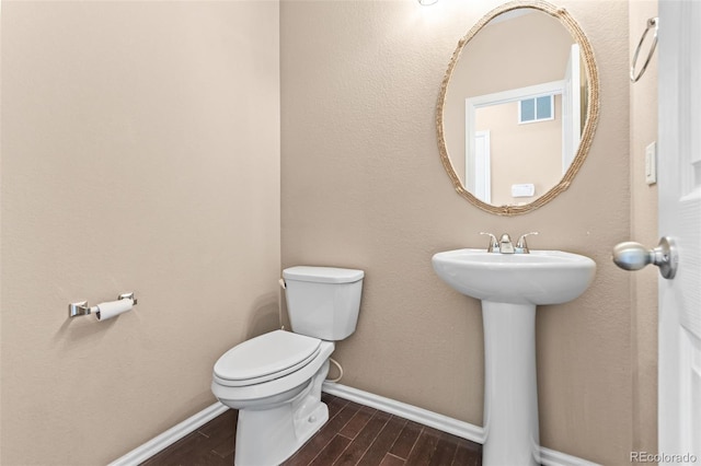 bathroom featuring toilet