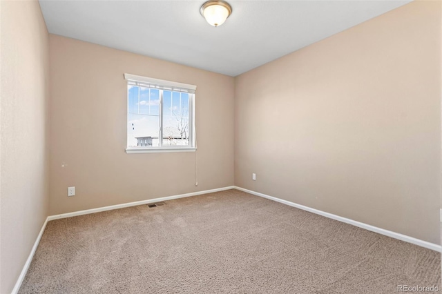 unfurnished room featuring carpet floors