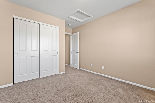 unfurnished bedroom with a closet and carpet flooring