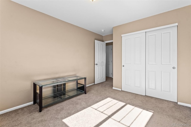 carpeted bedroom featuring a closet