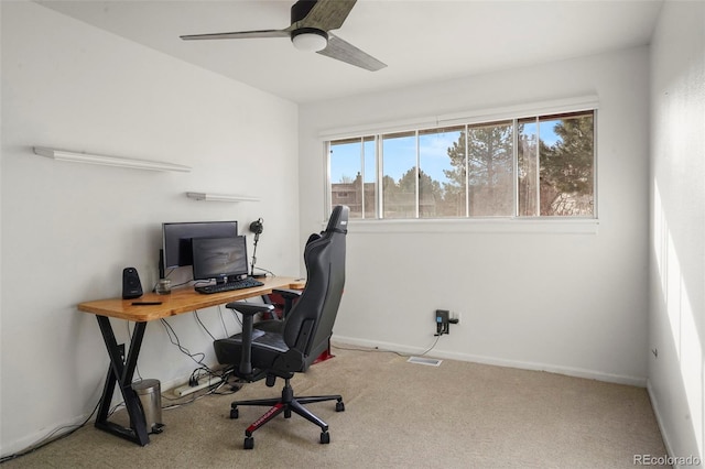 office space with light carpet and ceiling fan