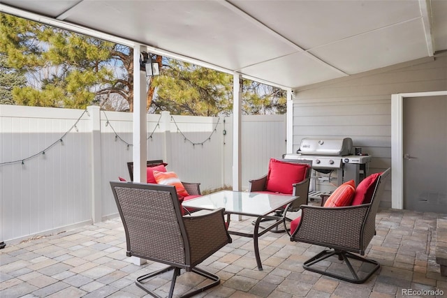 sunroom / solarium featuring lofted ceiling