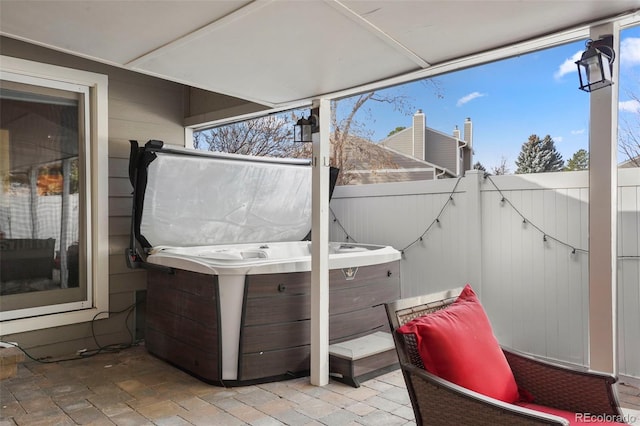 view of patio with a hot tub