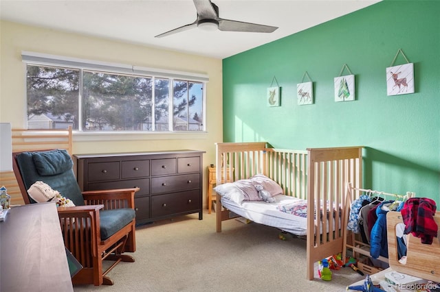 carpeted bedroom featuring ceiling fan