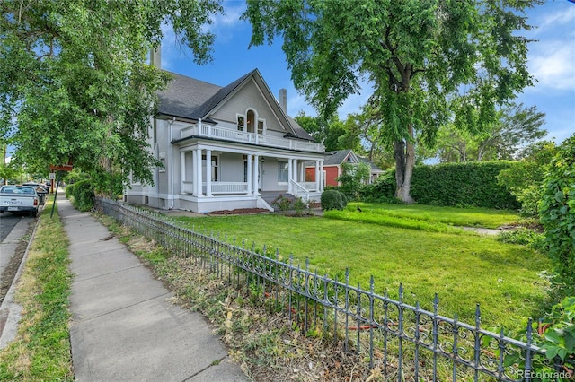 7011 Grandview Ave, Arvada, CO 80002 - victorian home with a porch and a balcony