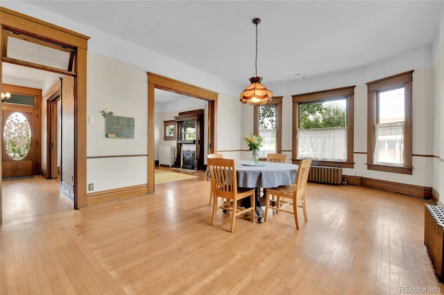 7011 Grandview Ave, Arvada, CO 80002 - dining space with radiator and light wood-style floors