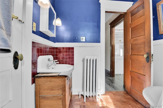7011 Grandview Ave, Arvada, CO 80002 - bathroom featuring radiator heating unit and vanity