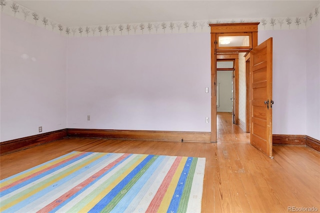 7011 Grandview Ave, Arvada, CO 80002 - spare room featuring light wood-style flooring and baseboards